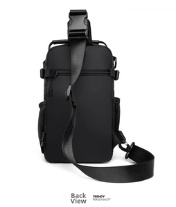Detail view of the back of a black outdoor chest bag with mesh pockets and adjustable straps