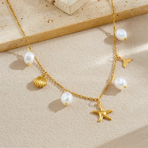 Gold stainless steel necklace with irregular pearls, starfish, seashell, and whale tail charms