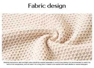 Detail of beige waffle knit fabric texture with English washing instruction text