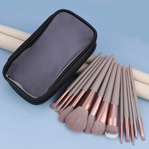 Pink makeup brush set with 13 pieces and a transparent waterproof pouch for travel
