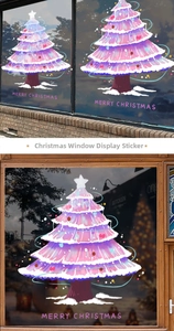 Detail of pink Christmas tree window sticker with Merry Christmas greeting text
