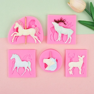 Pink silicone fondant molds featuring carousel horse, unicorn, and elk shapes for baking