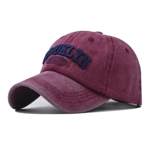 Close-up of Brooklyn 1947 embroidery on burgundy washed cotton baseball cap