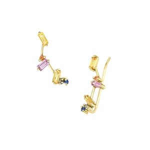 Detailed shot of gold C-shaped earrings with colorful rectangular and round gemstones