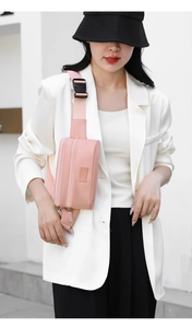 Close-up of pink oxford waist bag with adjustable strap and quick-release plastic buckle