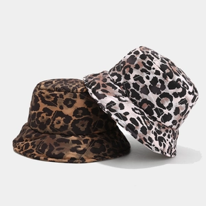 Macro detail of quilted leopard print bucket hats in brown and white textured fabric