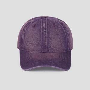 Detailed close-up of purple washed vintage cotton denim baseball cap with curved brim