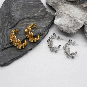 Minimalist C-shaped irregular textured earrings in gold and silver stainless steel finishes