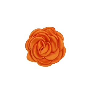 Detail of vibrant orange handmade satin camellia flower for apparel and accessories