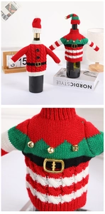 Macro detail of knit Christmas wine bottle sweaters with bells and striped elf hat decor