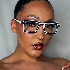 Close-up of model wearing 2D cartoon style TR90 glasses with black and white thick frames