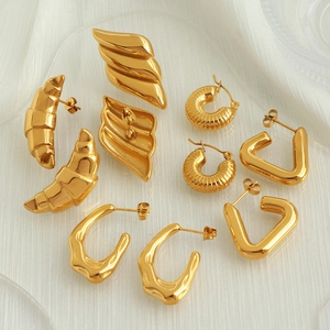 Minimalist 18k gold plated earring set featuring croissant and geometric triangle designs