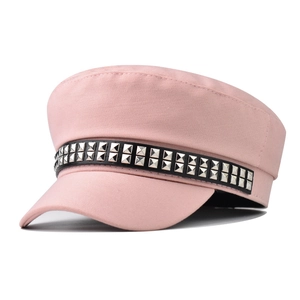 Pink flat top military cap featuring black leather strap with silver square metal rivets