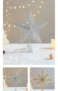 Close-up of golden and silver wire star tree toppers with spring base and battery box