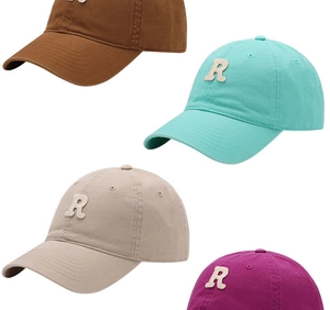 Close-up of baseball caps with 3D towel embroidered R letter in multiple colors