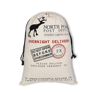 Christmas drawstring canvas gift bag with reindeer print and North Pole Post office text