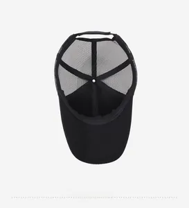 Internal view of black mesh baseball cap showing breathable lining and adjustable strap