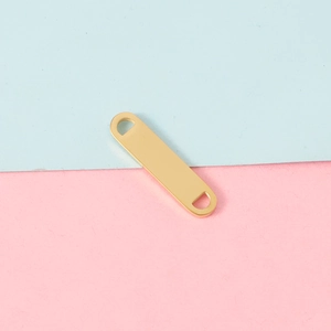 Detailed view of mirror-polished gold stainless steel connector plate for DIY jewelry