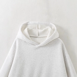Fashionable grey oversized hoodie with drawstring hood and soft cotton fleece fabric