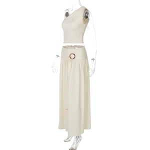 Detailed view of beige one-shoulder top and maxi skirt set with metal ring belt detail