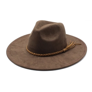 Detail of a brown suede fedora hat featuring a stylish braided decorative band accessory