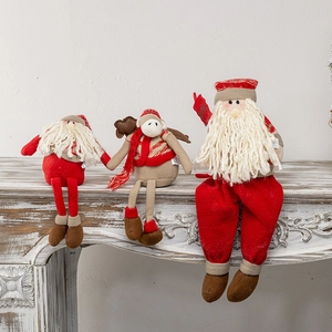 Christmas plush dolls set with Santa and reindeer on a white fireplace mantel decoration