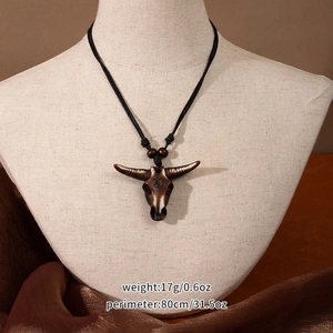 Detail of Maori fish hook bull skull necklace with dimensions 17g weight and 80cm length