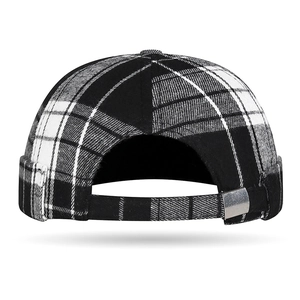 Classic black and white checkered docker cap with adjustable metal buckle back view
