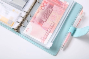 Detail view of light blue A6 PU leather binder with 6-ring clips and PVC zipper pockets