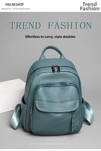 Detail showing high-quality lychee texture leather and rivet accents on dark green backpack