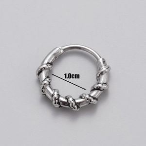 Macro detail of 1.0cm vintage twisted rope earring in blackened stainless steel