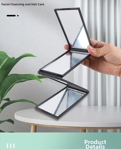 Detailed close-up showing the portable 3-way folding makeup mirror with black frame
