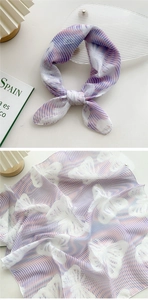 Detail of sheer chiffon scarf with lavender stripes and butterfly print in a lifestyle setting