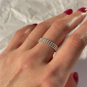 Minimalist 925 sterling silver beaded ring shown on hand with high gloss silver finish