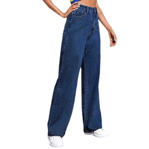 Detail view of high-waisted wide leg jeans in dark blue denim with loose fit texture