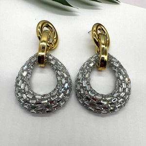 Elegant teardrop rhinestone earrings featuring gold metal links and crystals in a retro style