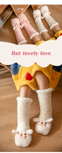 Detail of coral fleece winter socks with 3D animal ears and cartoon embroidery on warm mat