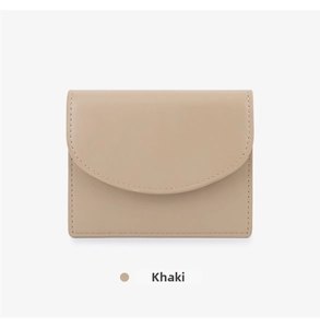 Close-up of khaki leather card holder with precise stitching and curved flap closure