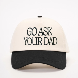 Detailed embroidery of Go Ask Your Dad text on a black and white baseball cap