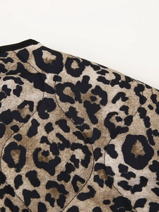 Macro view of leopard print quilted jacket texture with detailed diamond stitching
