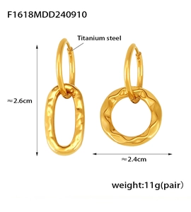 Detail view of gold titanium steel asymmetric earrings with hammered texture and dimensions