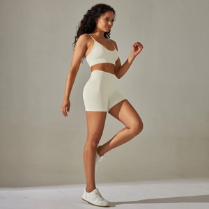 Detail of seamless ribbed knit sports set with V-neck bra and high waist shorts