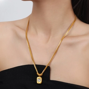 Double layer snake chain necklace with golden square heart zircon pendant on model
