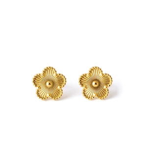 Elegant gold flower stud earrings with detailed five-petal radial texture on white background