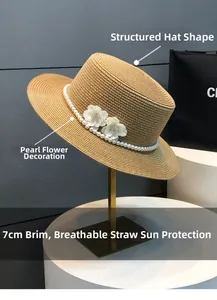 Detail of the 7cm flat top straw hat featuring a pearl chain and white floral accents