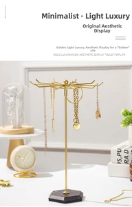 Présentoir à bijoux rotatif doré avec 10 crochets et base en marbre pour le rangement