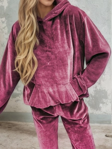Detailed view of mauve velvet hoodie fabric texture with soft sheen and kangaroo pocket