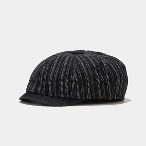 Cappello newsboy blu navy gessato in denim lavato per un look vintage classico da donna