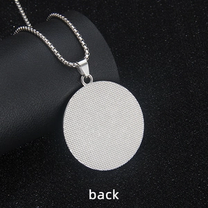 Back view of round stainless steel Evil Eye pendant necklace with textured silver finish