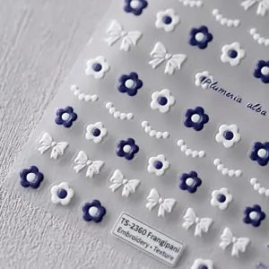 3D embossed nail art stickers featuring blue and white Plumeria flowers and bows